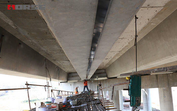 Prestressed carbon laminate in bridge strengthening