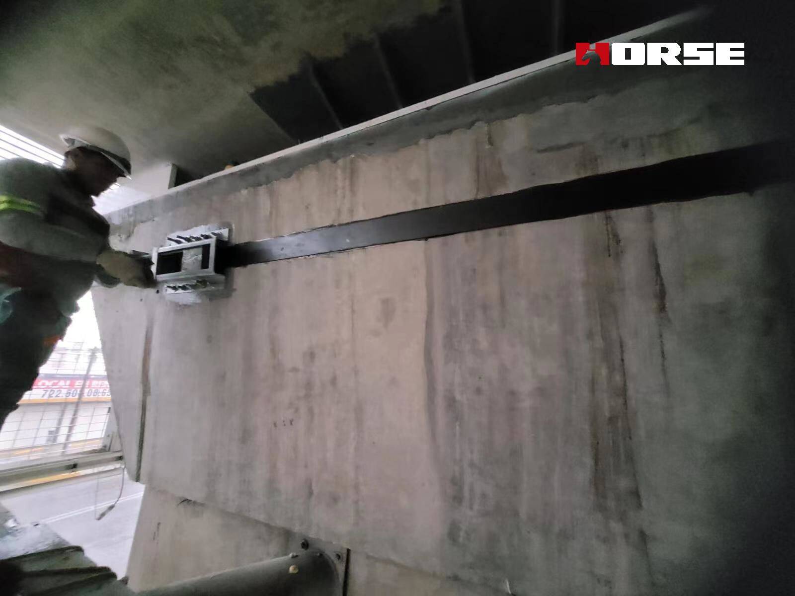 Strengthening of Bridge Structures with post tensioned CFRP plates