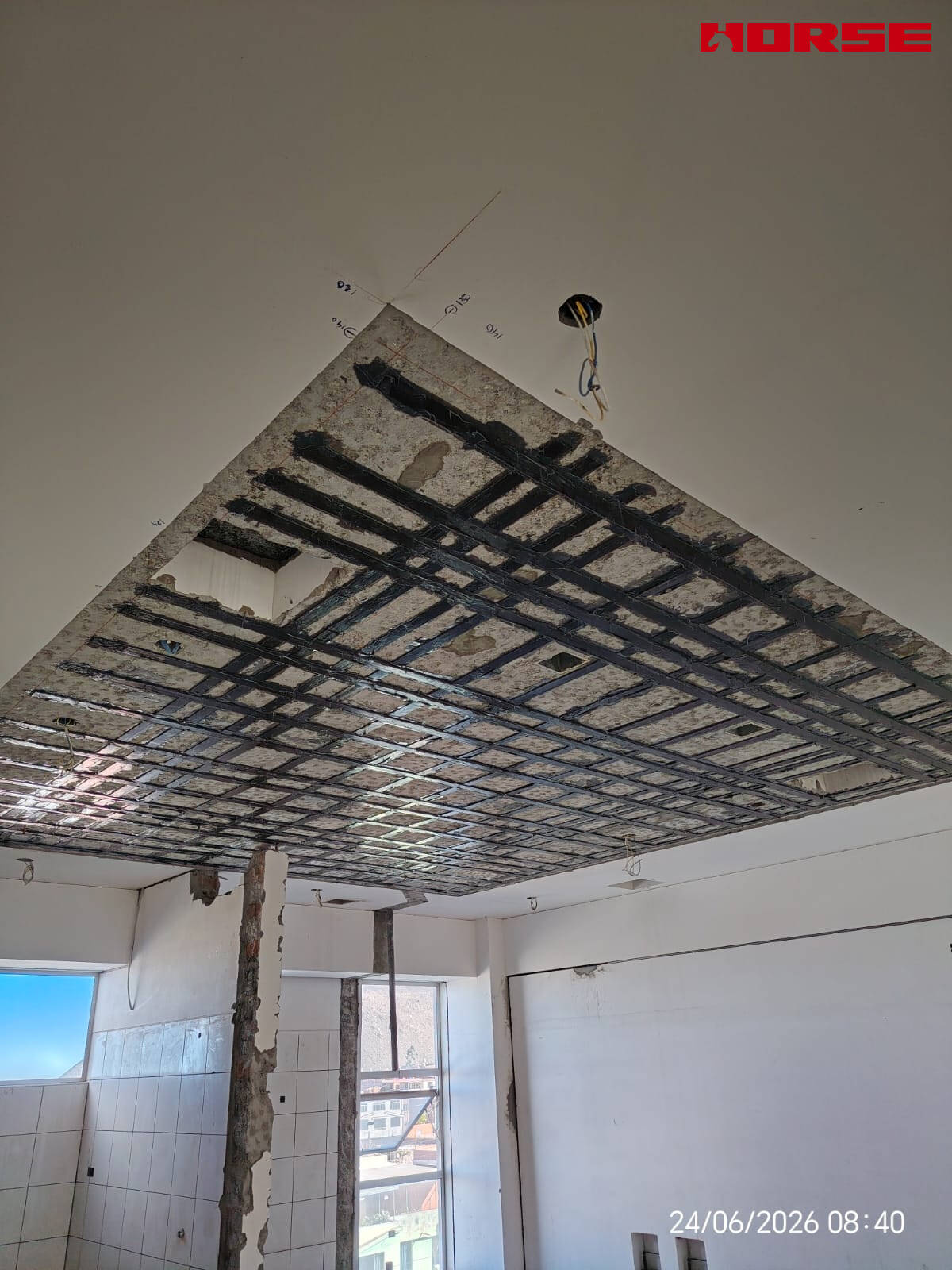 Carbon Fiber Plate Strengthening of RC Slabs with Openings
